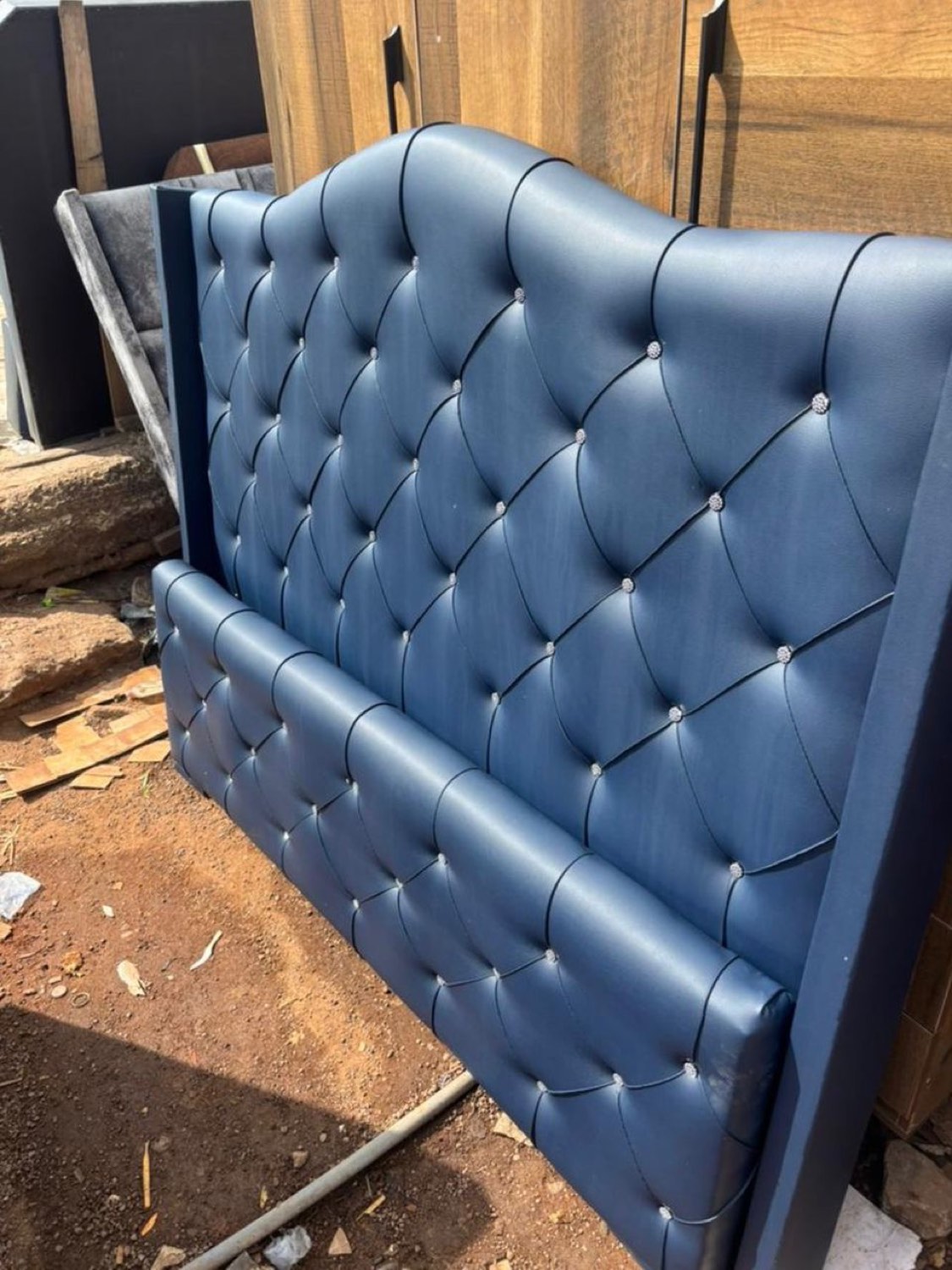 Navy buttoned leather headboard with diamanté buttons