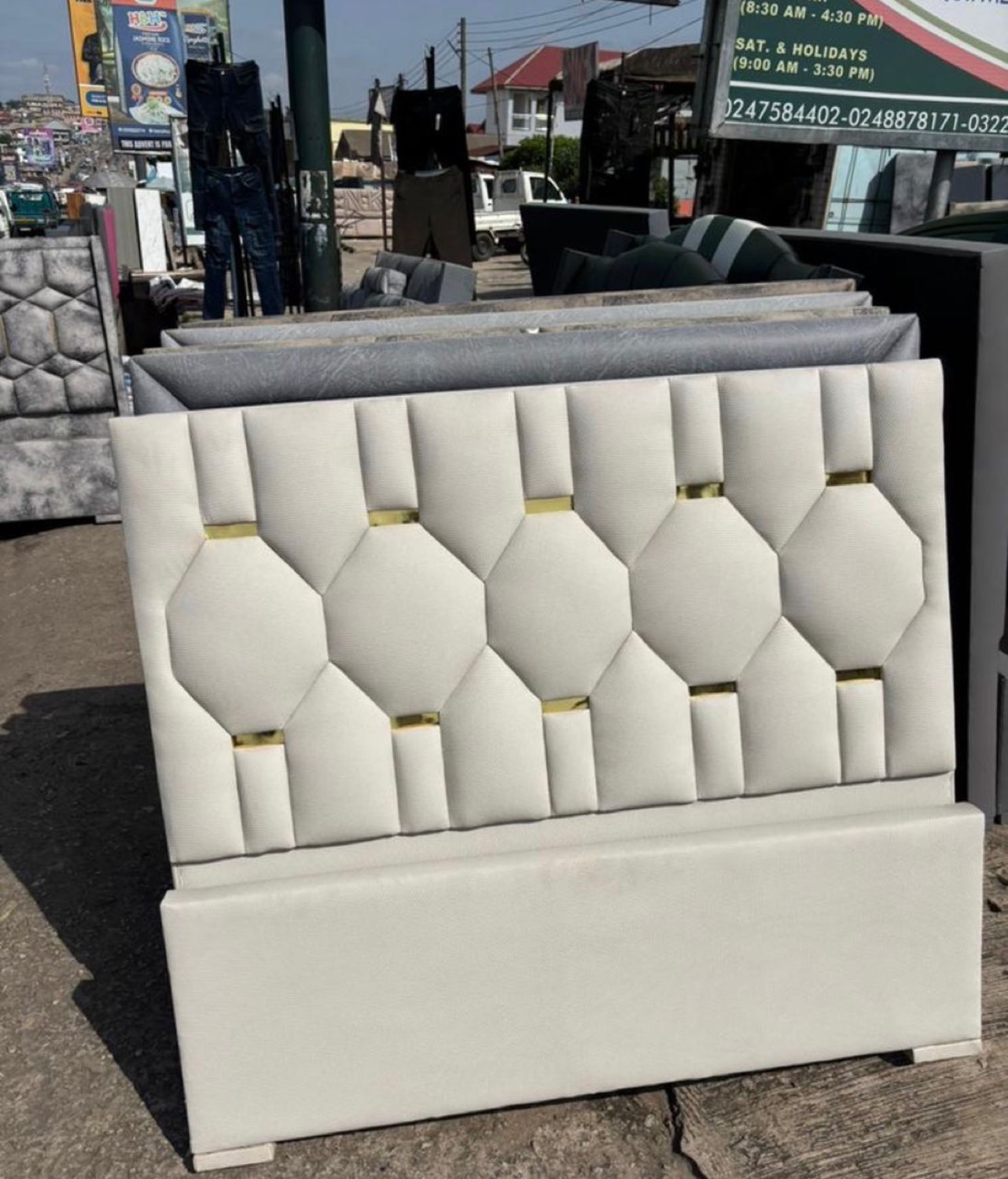 White octagon-tufted headboard with gold detail