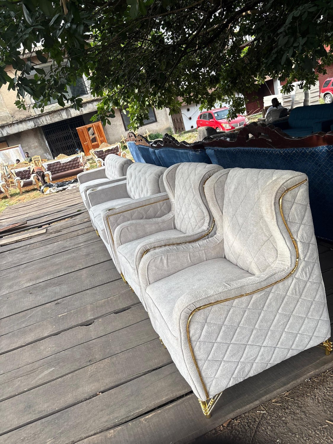 Cream quilted sofa suite with a slim gold edge