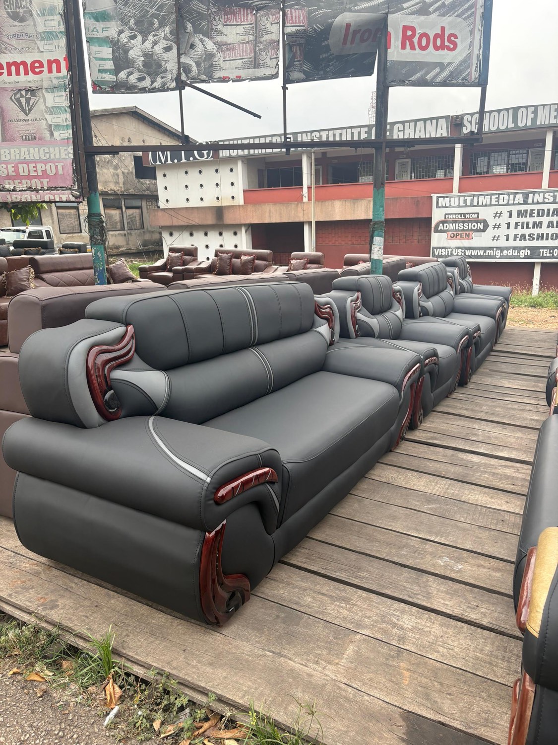 Black and red leather sofa set with carved wood arms