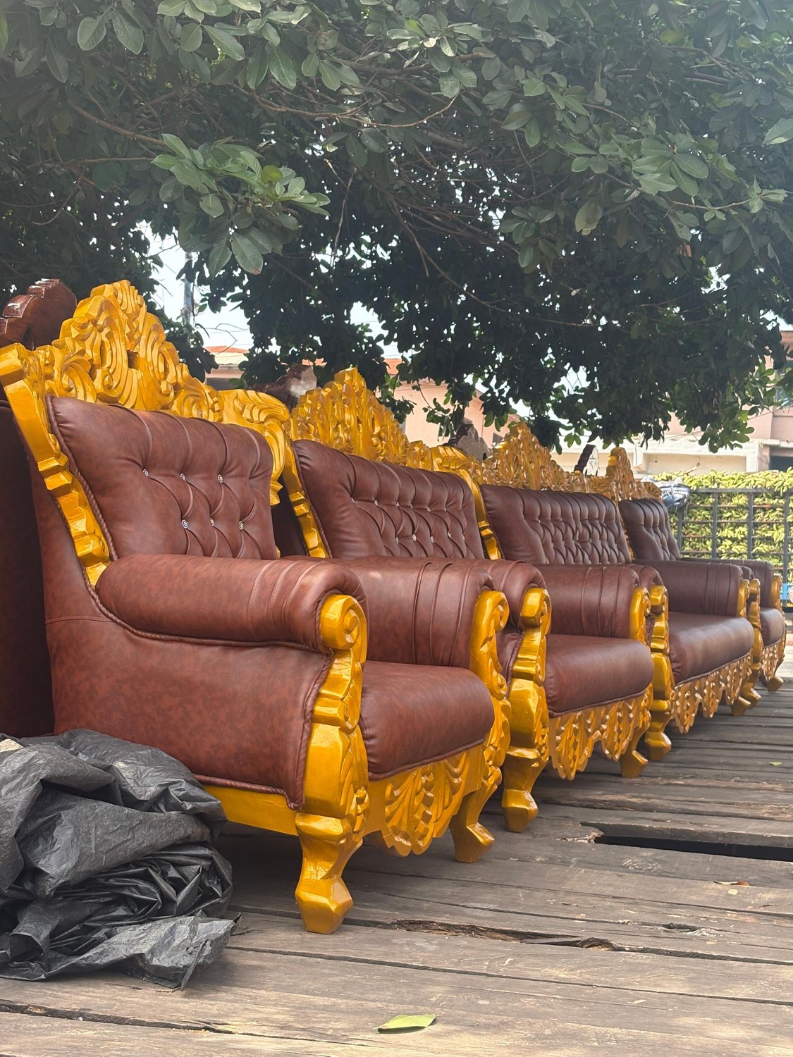 Hand-carved gilded leather armchairs